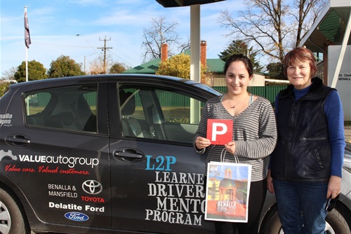 L2P driver and mentor next to the L2P car