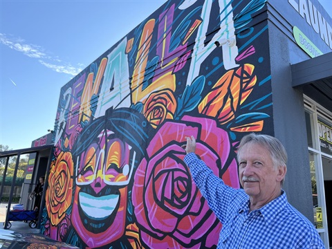 Mayor Claridge in front of the new Benalla Mural